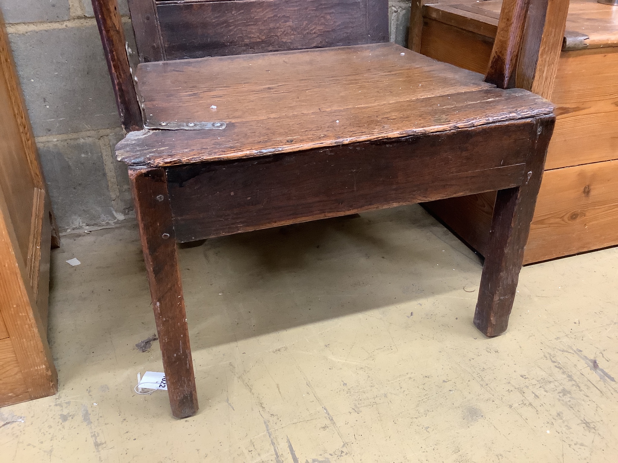 An early 18th century oak elbow chair